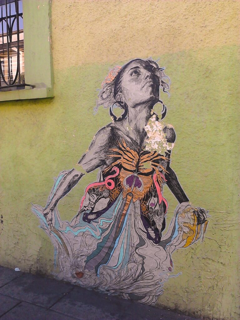 mural portrays a woman gazing towards the sky